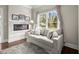Comfortable sitting area with a fireplace and large window with a view at 383 Indian Hills Trl, Marietta, GA 30068