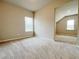 Bright bedroom featuring carpet floors and natural light from two windows at 5119 Aylesbury Ct, Hoschton, GA 30548