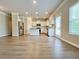 Spacious open-concept kitchen with granite countertops, stainless steel appliances, and modern white cabinets at 5119 Aylesbury Ct, Hoschton, GA 30548