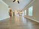 Expansive living area with wood floors, recessed lighting, and an open layout perfect for entertaining at 5119 Aylesbury Ct, Hoschton, GA 30548