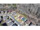 A stunning aerial view showcases the home's architectural details and its lovely surroundings at 7130 Rocking Horse Ln, Cumming, GA 30040