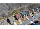 Home aerial view shows adjacent neighborhood with houses at 7130 Rocking Horse Ln, Cumming, GA 30040