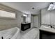 Bright bathroom features double vanities, a soaking tub, and lots of natural light at 7130 Rocking Horse Ln, Cumming, GA 30040