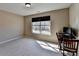 Neutral bedroom with carpeted floors, bright light, and a sunny view at 7130 Rocking Horse Ln, Cumming, GA 30040