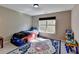bedroom featuring playful decor, neutral walls and plenty of natural light at 7130 Rocking Horse Ln, Cumming, GA 30040
