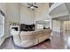 Spacious living room with soaring ceilings, fireplace, and large windows offering ample natural light at 7130 Rocking Horse Ln, Cumming, GA 30040
