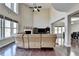 Large living room with high ceilings, hardwood floors, and an open layout leading to the dining area at 7130 Rocking Horse Ln, Cumming, GA 30040