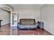 Cozy living room with hardwood floors, a plush sofa, and neutral wall color at 7130 Rocking Horse Ln, Cumming, GA 30040