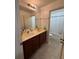 Bathroom with a double sink vanity, ample counter space, and a separate bathtub with shower at 1668 Scenic Pines Dr, Lawrenceville, GA 30044
