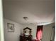 Bedroom with neutral colored walls, matching vanity and a window with bright, natural light at 1668 Scenic Pines Dr, Lawrenceville, GA 30044