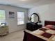 Bedroom with two windows, carpeted flooring, a sewing machine and a decorative vanity set at 1668 Scenic Pines Dr, Lawrenceville, GA 30044