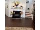 Inviting living room with a cozy fireplace and hardwood floors leading to stairway at 1668 Scenic Pines Dr, Lawrenceville, GA 30044