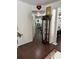 Inviting hallway with elegant dark wood flooring, decorated with tasteful decor and showcasing a seamless flow at 1668 Scenic Pines Dr, Lawrenceville, GA 30044