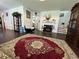 Inviting living room with a cozy fireplace and hardwood floors throughout the open area at 1668 Scenic Pines Dr, Lawrenceville, GA 30044