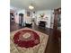Inviting living room with a cozy fireplace and hardwood floors throughout the open area at 1668 Scenic Pines Dr, Lawrenceville, GA 30044