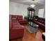 Living room with hardwood floors, a glass table and an ornate china cabinet at 1668 Scenic Pines Dr, Lawrenceville, GA 30044