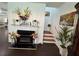 Inviting living room with a cozy fireplace and hardwood floors leading to stairway at 1668 Scenic Pines Dr, Lawrenceville, GA 30044