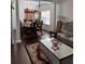 Elegant living room showcasing hardwood floors, formal dining area, decorative columns, and stylish furnishings at 1668 Scenic Pines Dr, Lawrenceville, GA 30044