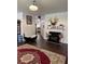 Inviting living room with a cozy fireplace and hardwood floors throughout the open area at 1668 Scenic Pines Dr, Lawrenceville, GA 30044