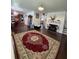 Inviting living room with a cozy fireplace and hardwood floors throughout the open area at 1668 Scenic Pines Dr, Lawrenceville, GA 30044