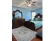 A primary bedroom boasting blue walls, hardwood floors and a patterned rug at 1668 Scenic Pines Dr, Lawrenceville, GA 30044