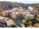 Aerial view of condo community by the Chattahoochee River and surrounding trees at 200 River Vista Dr # 713, Atlanta, GA 30339