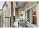 Relaxing outdoor balcony with patio furniture, offering a perfect space for enjoying the surrounding scenery at 200 River Vista Dr # 713, Atlanta, GA 30339