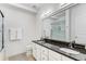 Bathroom features a double sink vanity with granite counters and walk-in shower at 200 River Vista Dr # 713, Atlanta, GA 30339