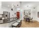 Dining area with modern light fixtures, bar area, a red front door and seating for four at 200 River Vista Dr # 713, Atlanta, GA 30339