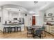 Bright kitchen with stainless steel appliances and counter seating open to a dining area at 200 River Vista Dr # 713, Atlanta, GA 30339