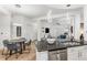 Open-concept kitchen and dining area with modern lighting and stainless steel appliances at 200 River Vista Dr # 713, Atlanta, GA 30339