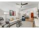 Bright living room features modern furnishings, neutral colors, ceiling fan and an open floor plan at 200 River Vista Dr # 713, Atlanta, GA 30339