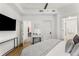 Bright main bedroom features a TV, vanity, closet and an en suite bathroom at 200 River Vista Dr # 713, Atlanta, GA 30339
