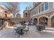 Charming outdoor patio with stone accents, comfortable seating, and a grill area for gatherings at 200 River Vista Dr # 713, Atlanta, GA 30339