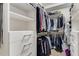 Bright walk-in closet features built-in shelves, drawers and hanging racks at 200 River Vista Dr # 713, Atlanta, GA 30339