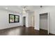 Light-filled bedroom with wood floors, window and closet space at 208 Indian Hills Trail, Marietta, GA 30068