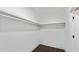 Walk-in closet features ample shelving, hardwood floor, and a clean design at 208 Indian Hills Trail, Marietta, GA 30068