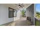 Covered outdoor deck with stone fireplace and scenic views at 208 Indian Hills Trail, Marietta, GA 30068