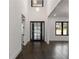Open foyer with chandelier and dark hardwood floors at 208 Indian Hills Trail, Marietta, GA 30068