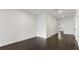 Bright hallway with hardwood floors and white walls, leading to various rooms at 208 Indian Hills Trail, Marietta, GA 30068