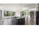 Open concept kitchen with island and hardwood floors at 208 Indian Hills Trail, Marietta, GA 30068