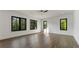 Sun-filled living area with contemporary design, hardwood floors, and large windows showcasing scenic views at 208 Indian Hills Trail, Marietta, GA 30068