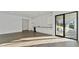 Modern living area features a wet bar, with a sliding glass door offering seamless indoor/outdoor living at 208 Indian Hills Trail, Marietta, GA 30068