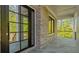 Covered porch with tile flooring and a full light front door at 208 Indian Hills Trail, Marietta, GA 30068