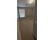 Bedroom with carpeted floor, a window with blinds, and neutral paint at 8628 Thomas Rd, Riverdale, GA 30274