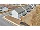 An aerial view of a modern home highlighting the well-maintained lawn and community at 1501 Branthaven Ln, Auburn, GA 30011