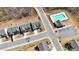 An aerial view showcases the homes, street layout, and the community pool at 1501 Branthaven Ln, Auburn, GA 30011