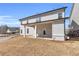 Spacious backyard with covered patio, creating an ideal space for outdoor living at 1501 Branthaven Ln, Auburn, GA 30011
