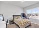 Well-lit bedroom featuring carpeted floors, neutral walls, and a window with neighborhood views at 1501 Branthaven Ln, Auburn, GA 30011