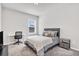 Cozy bedroom includes a workspace with desk, chair, and modern bedside table at 1501 Branthaven Ln, Auburn, GA 30011